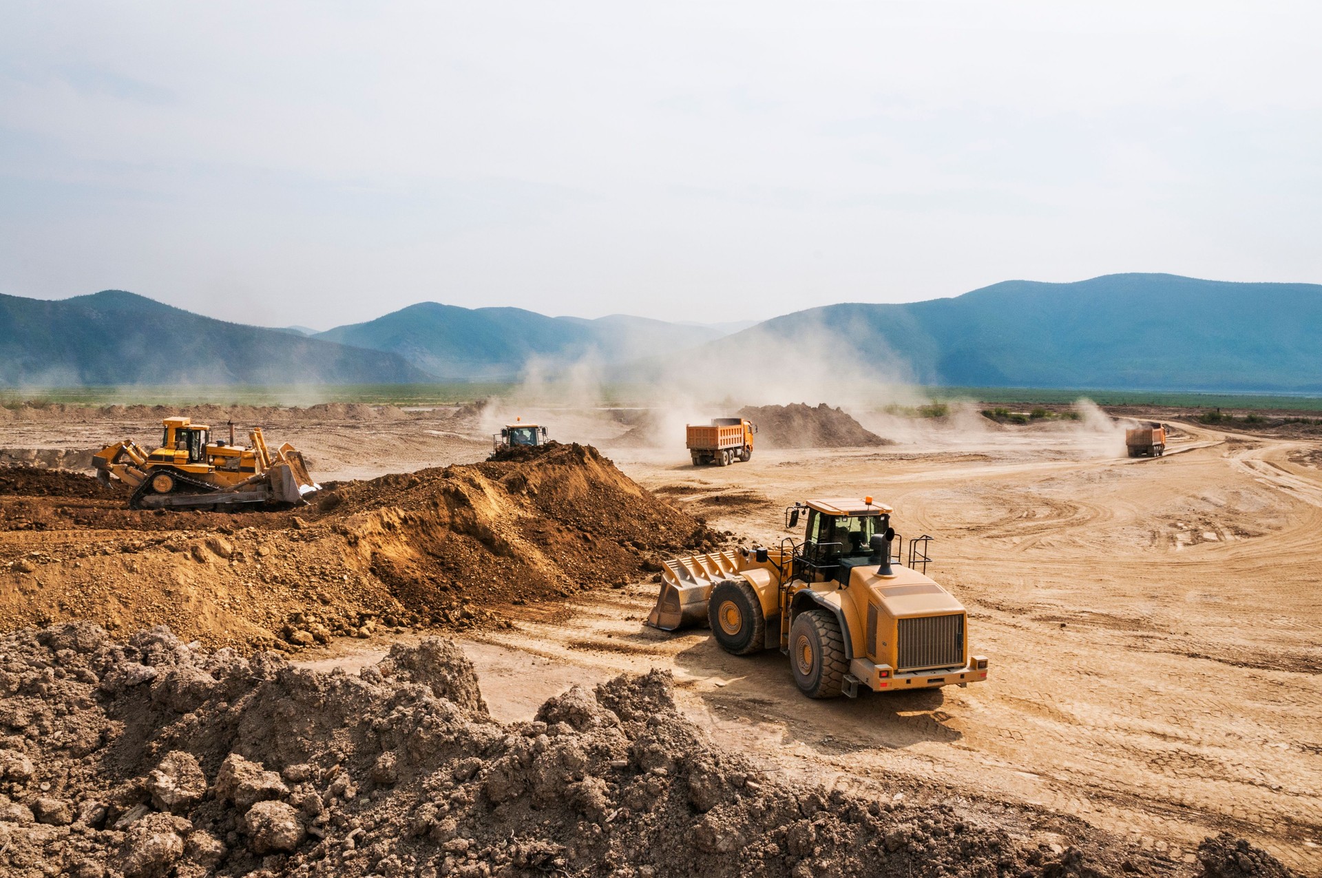Earthwork, working machinery on a summer day